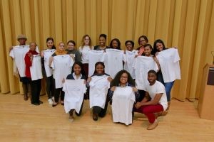 Conference attendees with the "Marginalization in Medicine" T-shirts after the networking mixer.