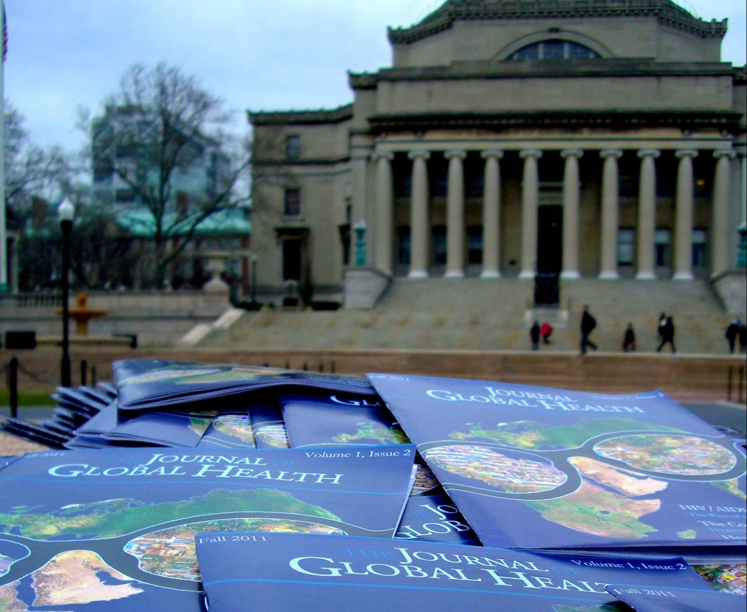 Image of magazines on a table in front of Low Library at Columbia University