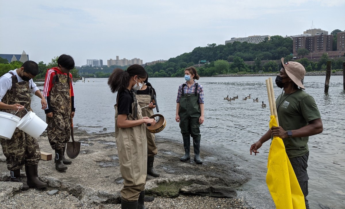 Students gathering samples in the Harlem River