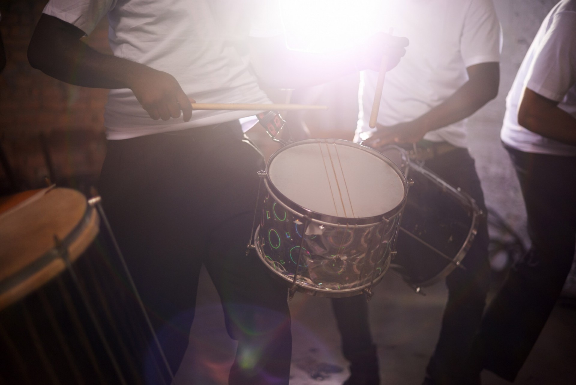 people playing drums. 