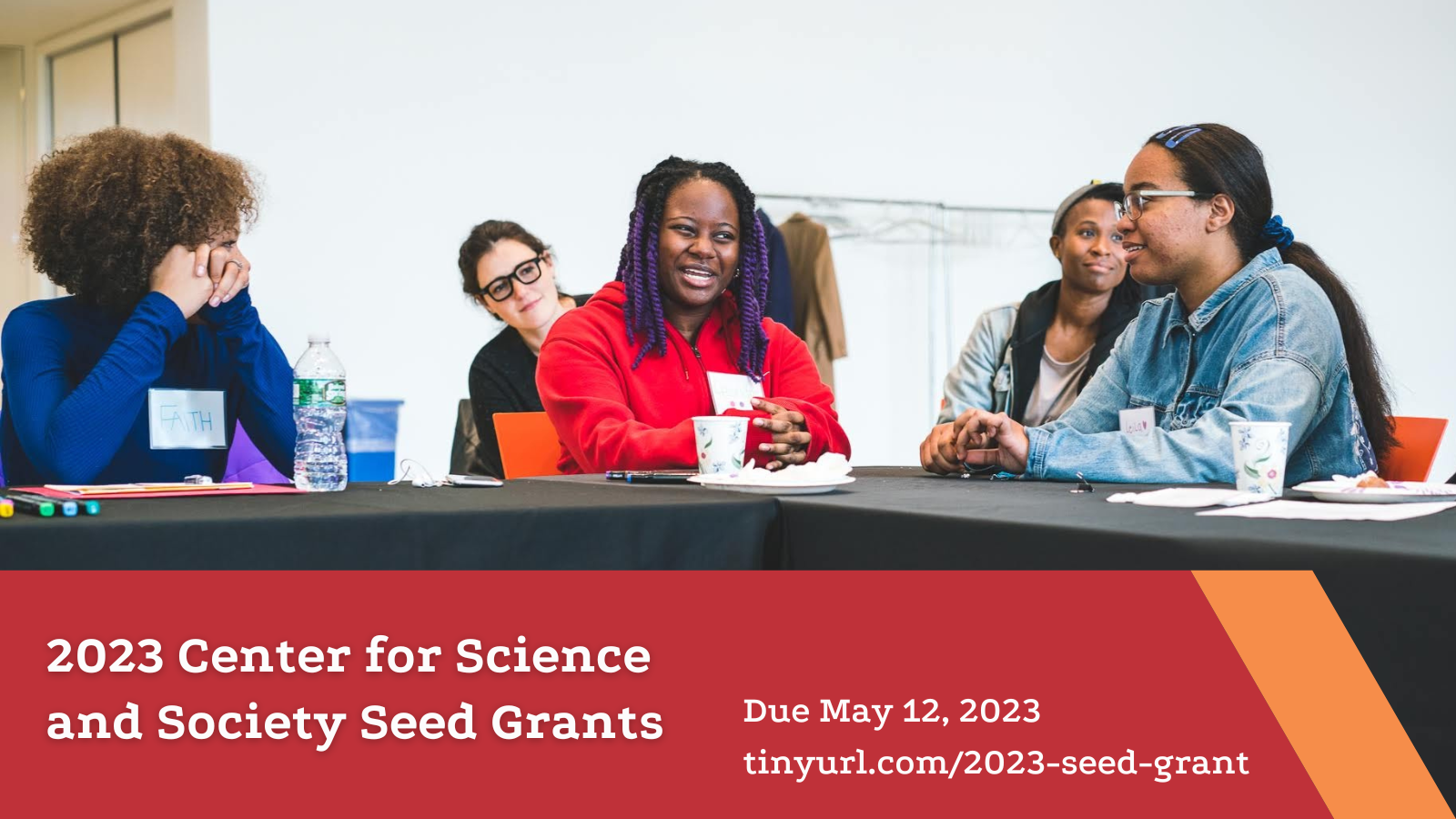2023 Center for Science and Society Seed Grant with image of students happily discussing. 