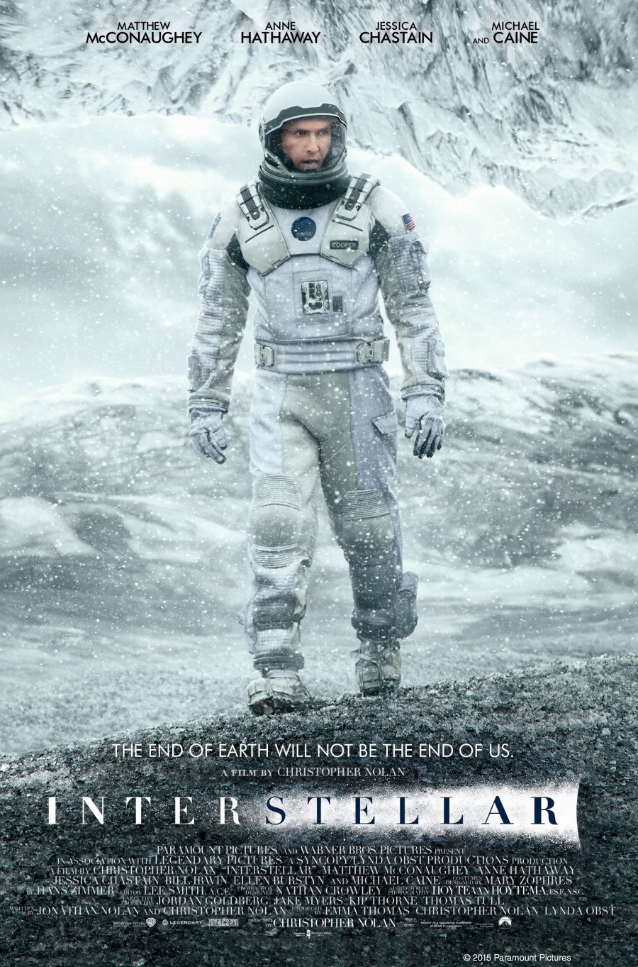 A movie poster of Interstellar, showing an astronaut walking on an alien planet