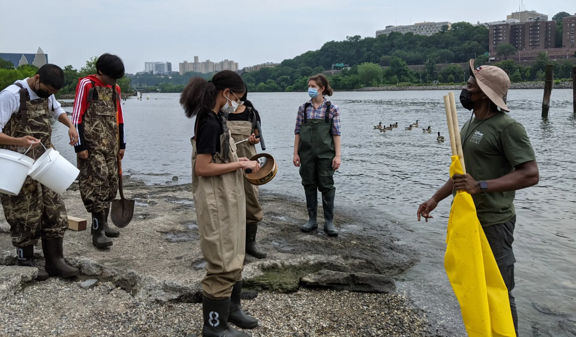 image of young students working in the water. 