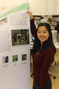 student showing poster