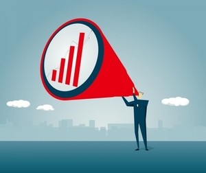 Graphic of a person holding up a speech bubble with a bar graph